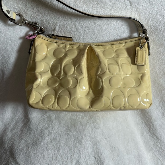 Coach Handbags - Coach Yellow Patent Leather Wristlet